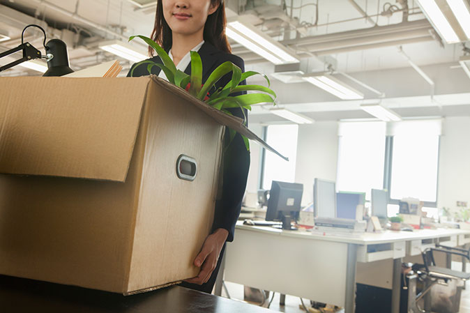 An employee lends a hand at moving office