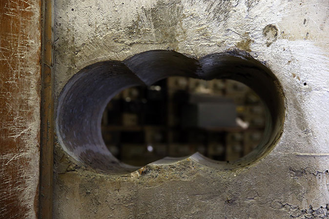 Peering through the hole in the Hatton Garden vault wall